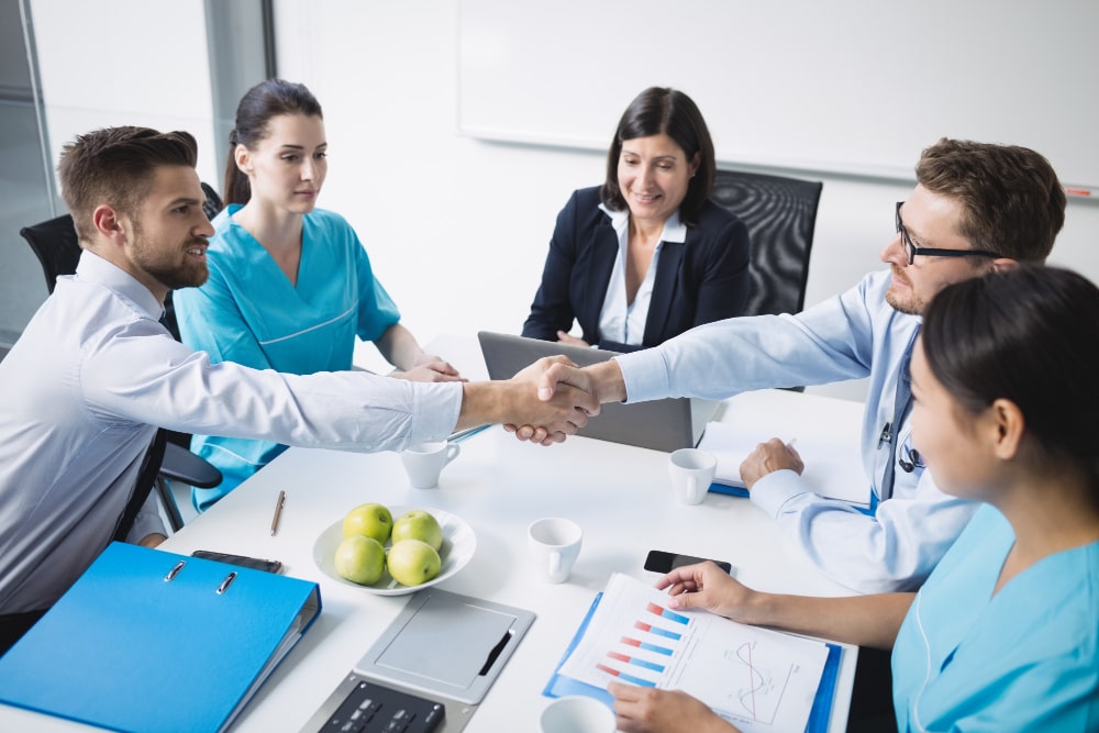 doctors-shaking-hands-with-each-other-min